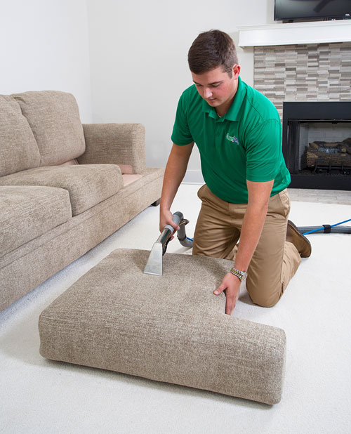 Metro Chem-Dry's technician cleans cushion in Newtown Square, leaving your home looking like new!